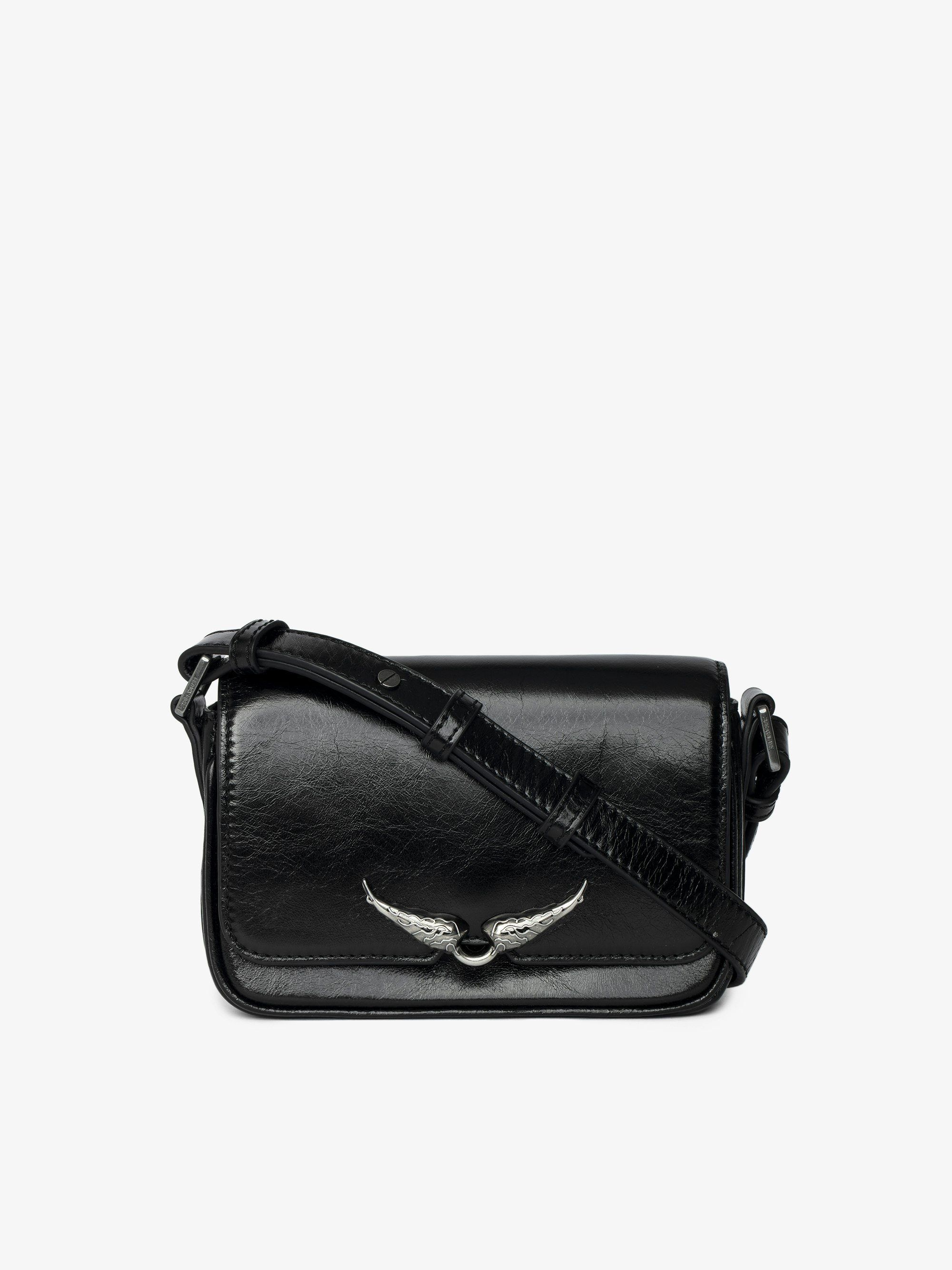 Le Zazi Vintage Patent Bag - Small vintage-inspired patent leather bag with adjustable shoulder strap and signature wings.