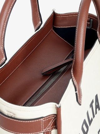 Angel Tote - Canvas and grained leather tote bag with double handles, shoulder strap and wing signature.