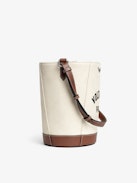 Bolso Z Bucket Voltaire - Bolso saco de lona y cuero granulado con correa ajustable y firma de alas.