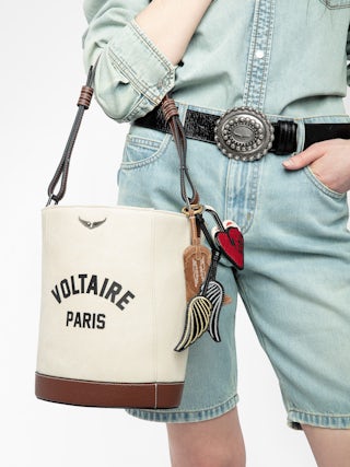 Z Bucket Voltaire Bag - Canvas and grained leather bucket bag with adjustable strap and wing signature.