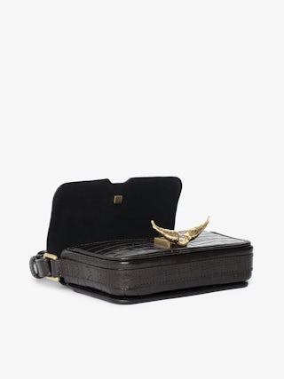 Le Zazi Croco Bag - Small croco-effect leather bag with adjustable shoulder strap and signature wings.