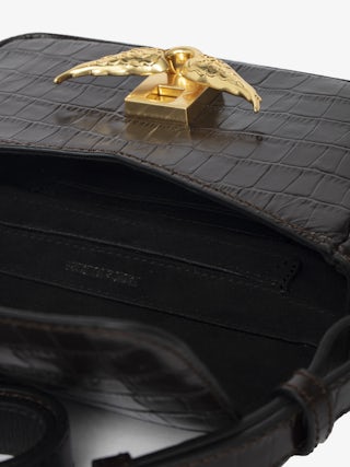 Le Zazi Croco Bag - Small croco-effect leather bag with adjustable shoulder strap and signature wings.
