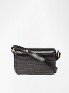 Le Zazi Croco Tasche - Kleine Tasche aus Leder mit Kroko-Effekt, verstellbarem Schulterriemen und charakteristischen Flügeln.