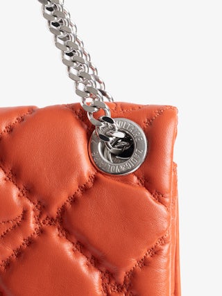 Rock II Quilted Monogram Clutch - Clutch in smooth quilted leather with sliding metal chain and signature wings.