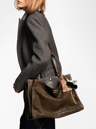 Jack Bag - Suede leather bag with signature clasp, featuring two compartments, one handle and adjustable strap.