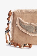 Mini Uma Clutch - Women's brown cotton clutch bag with fringing, wing patch and a beaded strap