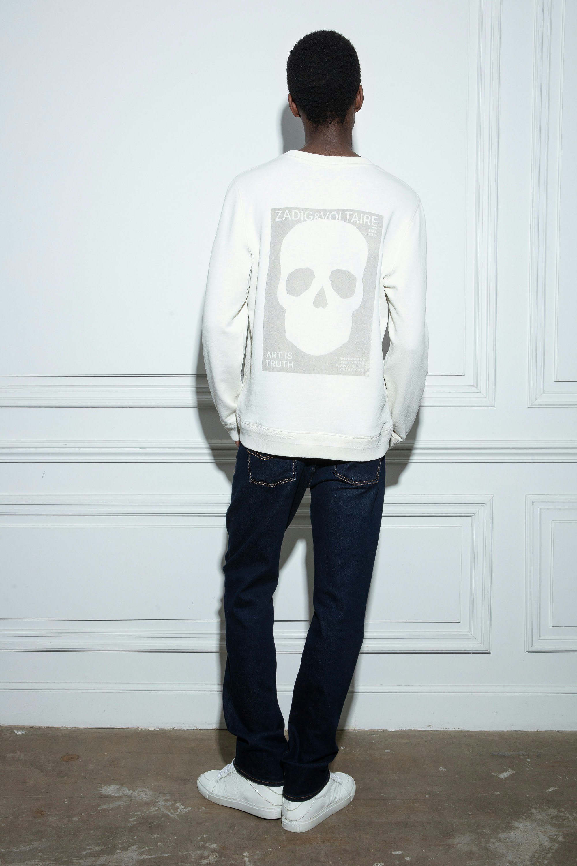 Stony Sweatshirt Men’s ecru cotton fleece sweatshirt with skull motif on the back.