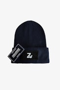 Mütze Tom für Jungen - Marineblaue Mütze aus Baumwolle und Wolle mit abnehmbarem Badge und aufgesticktem Etikett für Jungen.