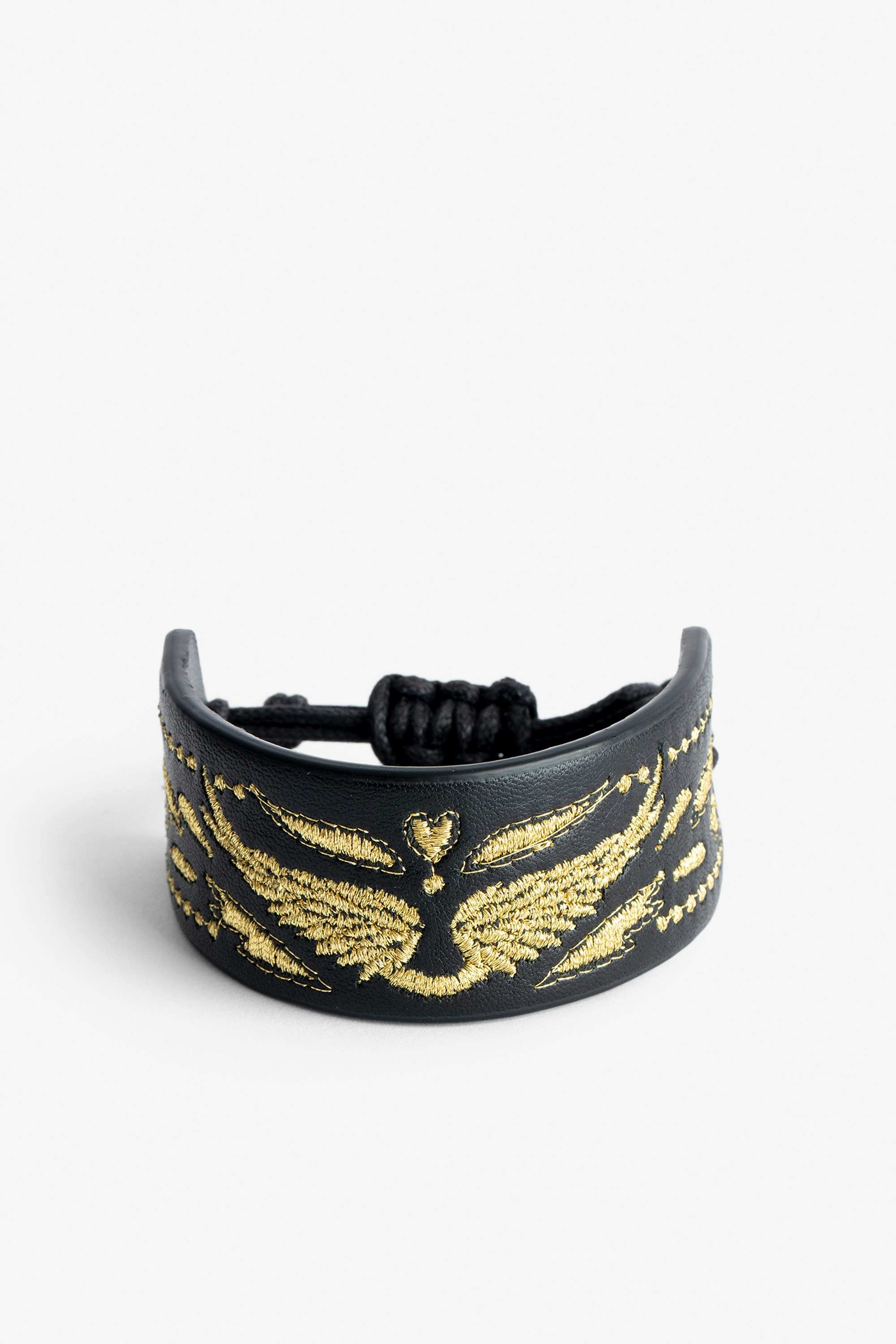 Bracelet Lenny  - Bracelet manchette en cuir Voltaire Vice noir à cordon de serrage orné d'ailes dorées.