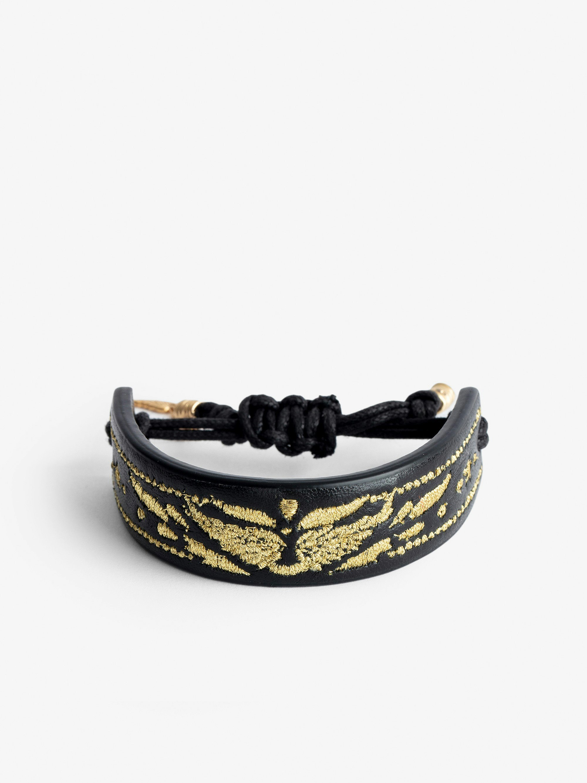 Bracciale Lenny - Bracciale rigido Voltaire Vice in pelle nero da annodare con ali dorate.