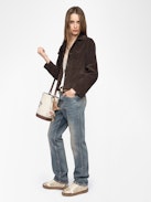 Lessa Suede Leather Jacket - Short buttoned jacket in suede leather with embossed wing on the back.
