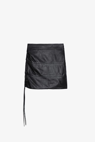 Jupe Jylo Cuir - Jupe courte en cuir noir à liens de serrage et ouvertures.