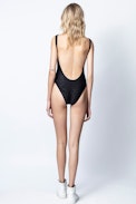 Jeri Swimsuit - Zadig&Voltaire women's black one-piece swimsuit, grey "wings" cross pattern.
Model made in Italy. 
Wash swimsuits by hand and dry them in the open air to maintain the quality of colors and fibres.