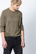 Liam Voltaire Sweater - Men’s khaki studded slogan sweater.