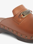 Azora Clogs - Leather clogs with wooden heel adorned with a wing charm chain.