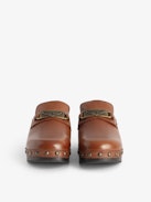 Azora Clogs - Leather clogs with wooden heel adorned with a wing charm chain.