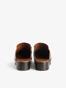 Azora Clogs - Leather clogs with wooden heel adorned with a wing charm chain.