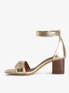 Caprese Sandals - Heeled sandals with leather strap adorned with a wing charm and a signature buckle.