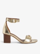 Caprese Sandals - Heeled sandals with leather strap adorned with a wing charm and a signature buckle.