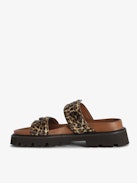 Mules Ride - Leopard-effect leather mules with adjustable strap, adorned with a signature buckle and wing charm.
