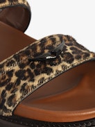 Mules Ride - Leopard-effect leather mules with adjustable strap, adorned with a signature buckle and wing charm.