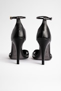 Sandalen Amee Leder - Damensandalen aus schwarzem Leder mit goldfarbener Spitze