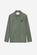 Bertie Skull Jacket - Men's khaki nylon jacket featuring a Skull XO badge on the chest.