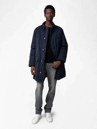 Mel Coat - Unisex mid-length coat featuring a rubber studio badge.