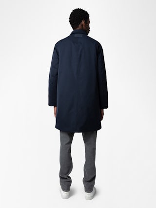 Mel Coat - Unisex mid-length coat featuring a rubber studio badge.