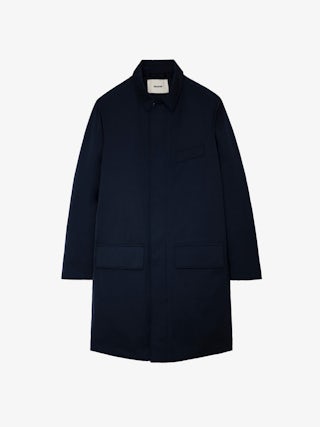 Mel Coat - Unisex mid-length coat featuring a rubber studio badge.