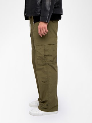Trousers Palmyr - Wide, fluid pants with an elastic drawstring waist, center button placket and zip fly, finished with embroidery.