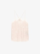 Christy Heart Camisole - A delicate blend of romance and modern style. This lingerie-inspired pink silk camisole features the exclusive Flash Hearts print, adding a playful touch to its elegant design. Crafted from luxurious silk, it offers a soft and comfortable feel against the skin. The V-neckline is adorned with contrasting lace trim, enhancing its feminine appeal, while the thin, adjustable spaghetti straps ensure a personalized fit. Its versatile style makes it a perfect addition to any wardrobe, suitable for both casual layering and sophisticated ensembles.