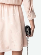 Rucas Dress - Light pink ruched mini dress with Flash Hearts print, long sleeves, and draped skirt.