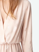 Rucas Dress - Light pink ruched mini dress with Flash Hearts print, long sleeves, and draped skirt.