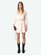 Rucas Dress - Light pink ruched mini dress with Flash Hearts print, long sleeves, and draped skirt.