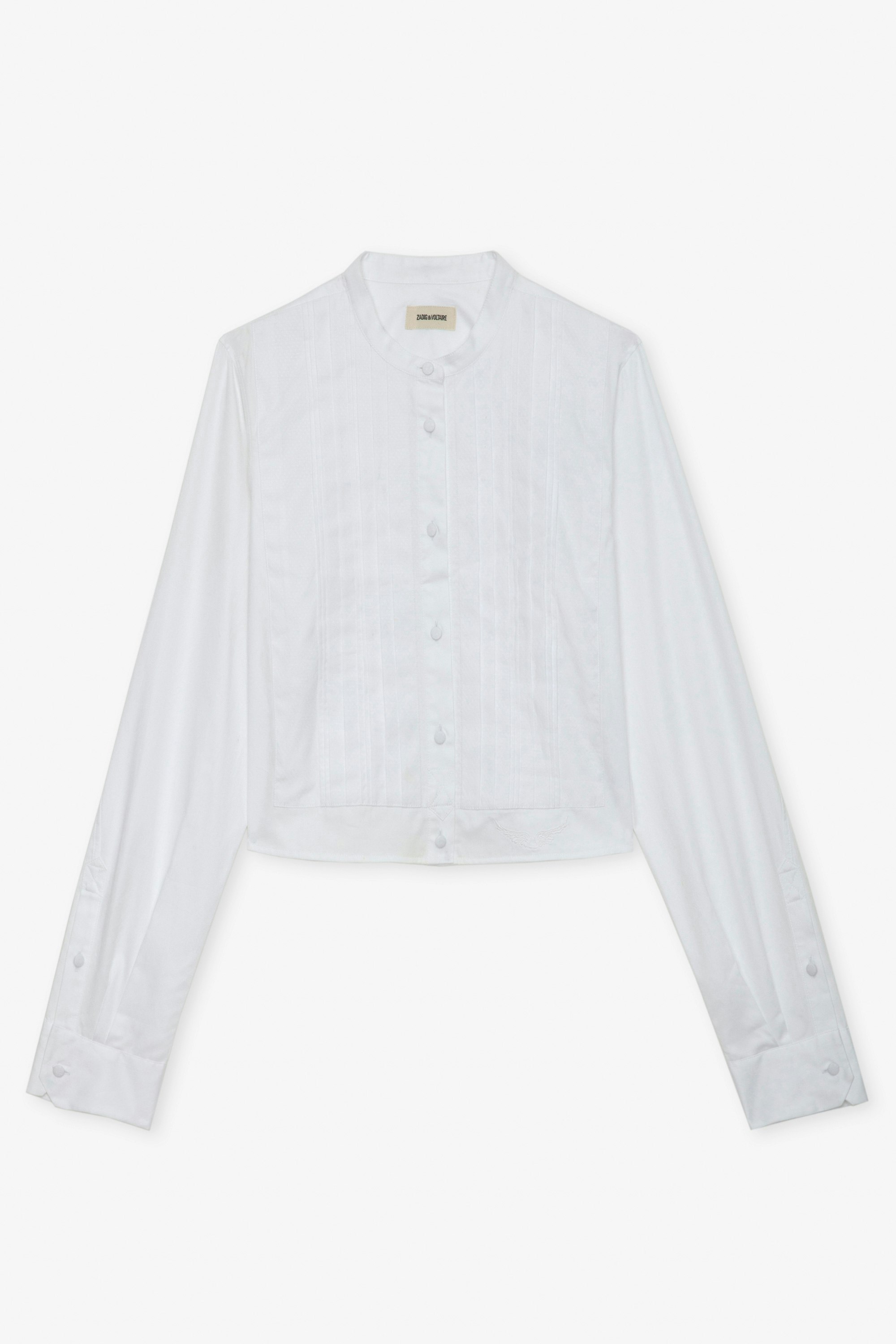 Camisa Theby - Camisa blanca corta de algodón con bordado de alas y detalles plisados.