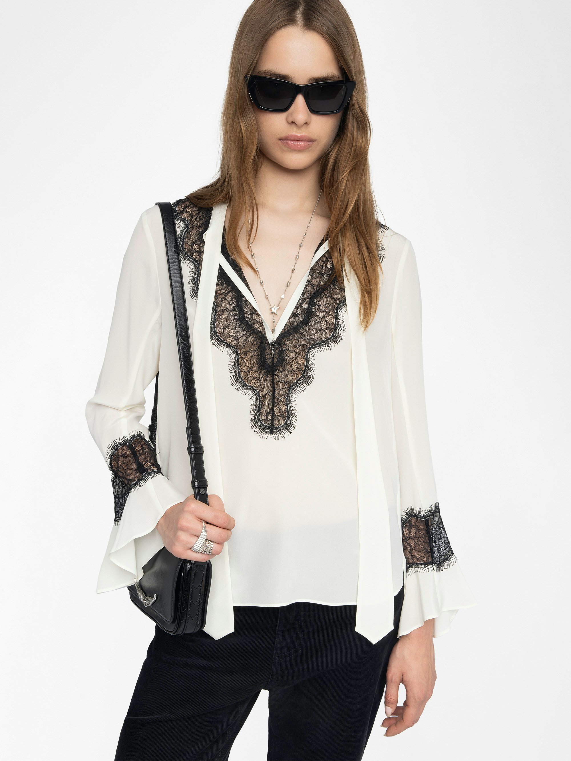 Tuan Lace Shirt - The Tuan shirt plays contrast with a soft ivory silk and bold black lace trim. Effortlessly sensual, it drapes with attitude—open neckline, flared cuffs, and just the right amount of rebellion.