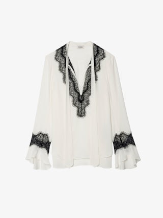 Tuan Lace Shirt - The Tuan shirt plays contrast with a soft ivory silk and bold black lace trim. Effortlessly sensual, it drapes with attitude—open neckline, flared cuffs, and just the right amount of rebellion.