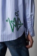 Tais Shirt - Women's striped cotton shirt in sky-blue with street art print