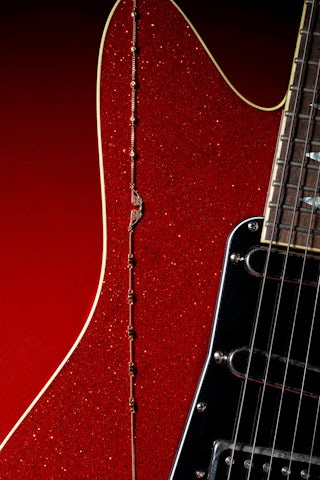 Rock Necklace - Necklace with chain and wing pendant adorned with rhinestones.